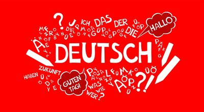 In der Mitte der Grafik steht auf rotem Grund das Wort DEUTSCH in weiß. Außenherum sind verschiedene deutsche Begriffe angeordnet, zum Beispiel: das, der, die, Hallo, Guten Tag, Zukunft, haben, Zukunft.